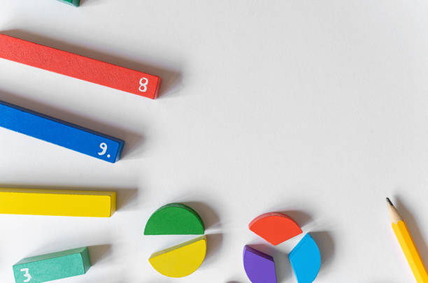 istock Math fractions on white background. Interesting math for kids. Education, back to school concept. Geometry and mathematics materials. Close up 1488026144