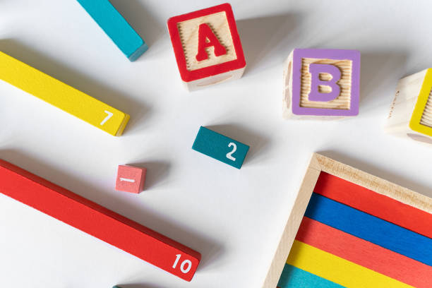 istock Math fractions on white background. Interesting math for kids. Education, back to school concept. Geometry and mathematics materials. Close up 1488026154