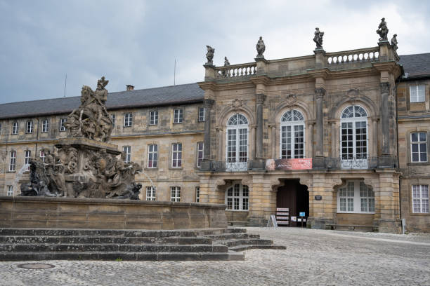 Bayreuth, Germany - May 1, 2022: The 18th-century Neues Schloss (New Palace) and the Margrave Fountain, designed by Elias Räntz in 1699-1705 as a monument to Margrave Christian Ernest of Brandenburg-Bayreuth.