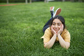young girl portrait over grass