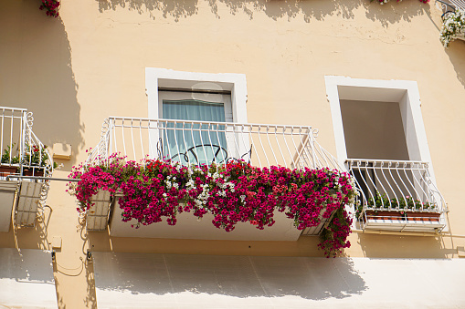 Cute balcony with pink flowers in Positano
