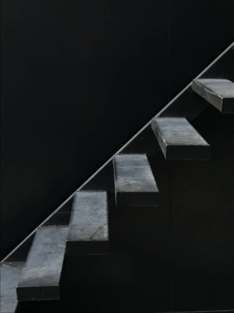 istock Steps of upstairs’ in darkness 1488034320