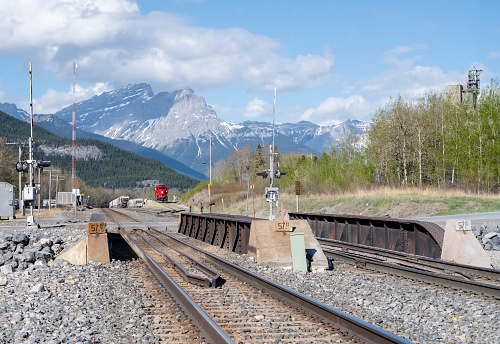 Railroad crossing in the Canadian Rocky Mountains near the Hamlet of Exshaw, Alberta