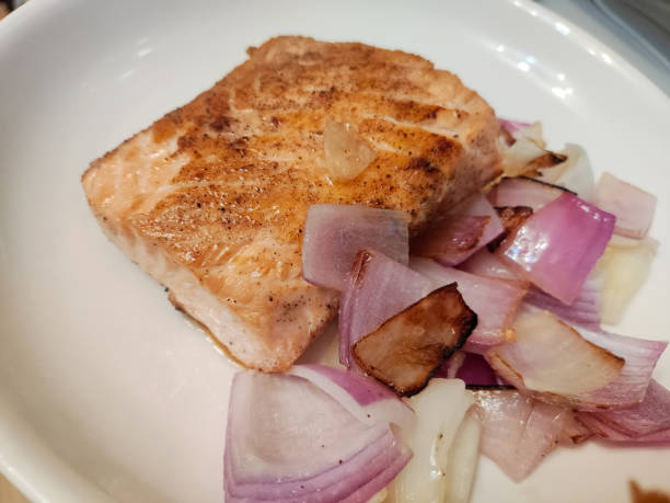 istock fresh fried salmon and onion on the white plate ready for eating 1488036900