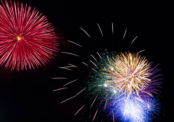 istock Fireworks shining in the night sky 1488041862