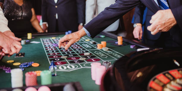Hand of dealer declaring a winner at the roulette table. You might also be interested in these:
