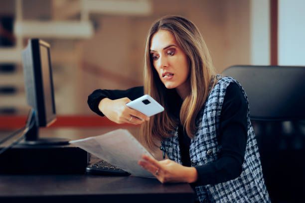 woman photographing secret documents at work corporate espionage style - employee theft imagens e fotografias de stock