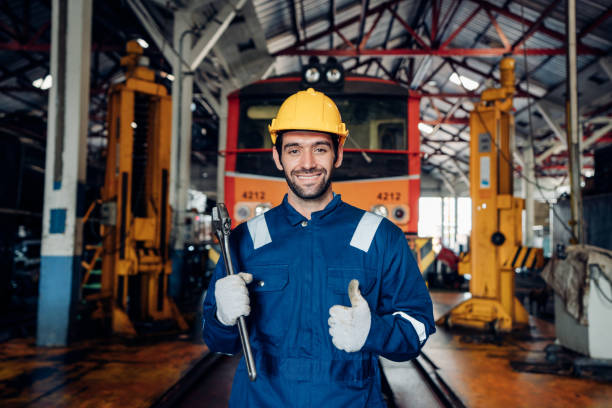 istock Engineer railway wearing safety uniform and helmet under checking under train ,wheels and control system for safety travel passenger. 1488049469