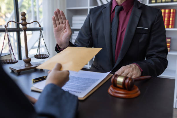 istock Corruption and Bribery,Businessman manager refusing receive money from Business man passing money dollar bills to deal contract.Corruption and anti bribery concept. 1488051130