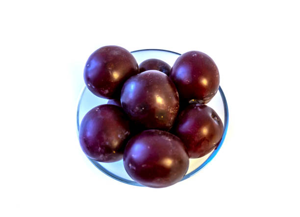 istock photo of plum on a plate, isolate 1488057056