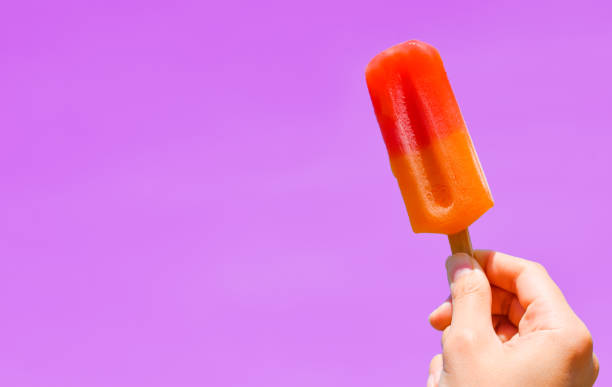 istock Ice cream in hand with copy space for text. summer background concept 1488058924