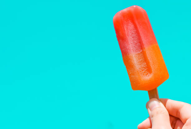 istock Ice cream in hand with copy space for text. summer background concept 1488058928