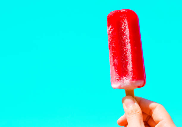 istock Ice cream in hand with copy space for text. summer background concept 1488058931