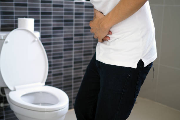 The man caught his stomach and had a painful stomach pain in the bathroom. Want to shit The man caught his stomach and had a painful stomach pain in the bathroom. Want to shit laxative stock pictures, royalty-free photos & images