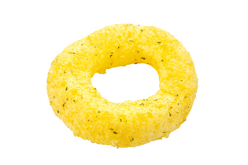 Crispy corn snack in the form of a ring. Traditional snack for beer. Isolated on white background. File contains clipping path