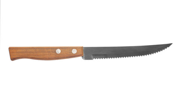 istock Steak knives . A serrated kitchen knife with a wooden handle. Isolated on white background. 1488068482