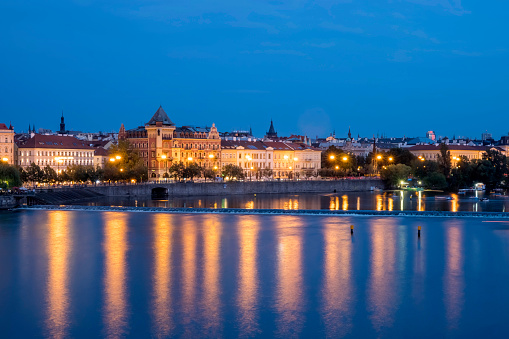Vltava River and old buildings in Prague, Czech Republic at night