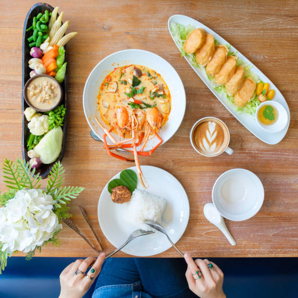 istock Young people eating in a Thai restaurant 1488071078