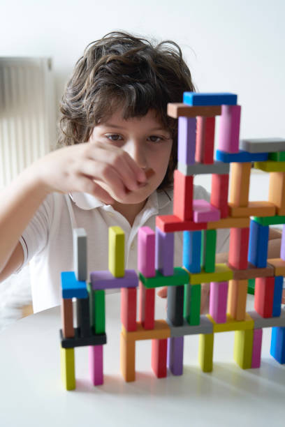 istock Cute Little Boy Playing with wooden block 1488072022
