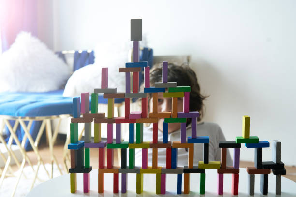 istock Cute Little Boy Playing with wooden block 1488072133