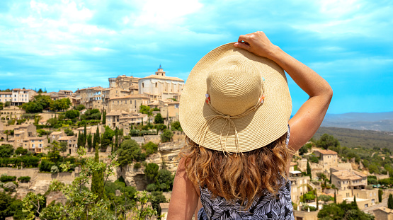 Woman tourist in France- Famous touristic village of Gordes in Provence