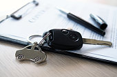 lease, rental car, sell, buy. Dealership manager send car keys to the new owner.  Sales, loan credit financial, rent vehicle, insurance,  renting, Seller, dealer, installment, car care business