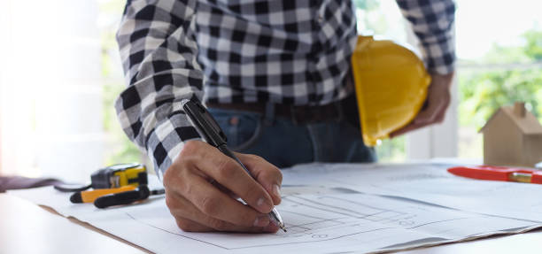 istock The work desk of the project contractor or engineer viewing the building structure plan 1488075391