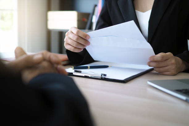 istock The executive opened a resignation letter from the employee. 1488075547