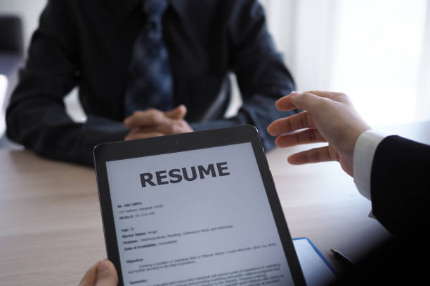 istock Executives are interviewing candidates and holding a tablet, opening the resume from the email that the applicant submits online. Discussing attitudes about work and special abilities. Considerations 1488075635