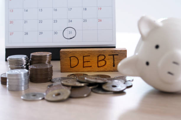 istock Due for repayment There are coins, calculators and calendar reminders placed on the table. 1488077881