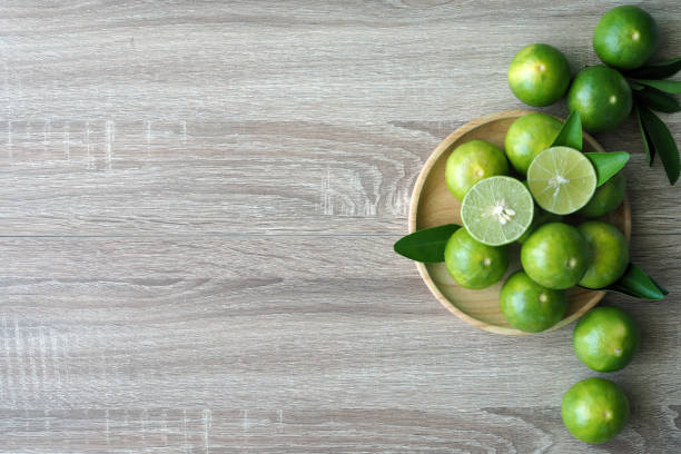 istock Lime placed on a wooden plate 1488078051