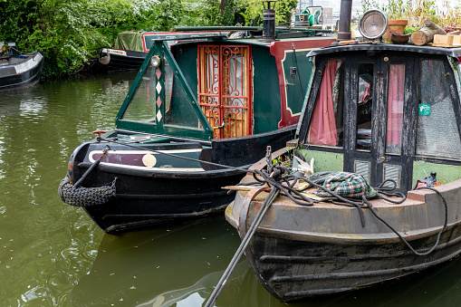 London. UK- 05.04.2023. Moored canal barges on Regent's Canal often used as homes for living and an alternative lifestyle.