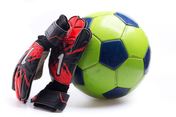 istock goalkeeper gloves and ball 1488083795