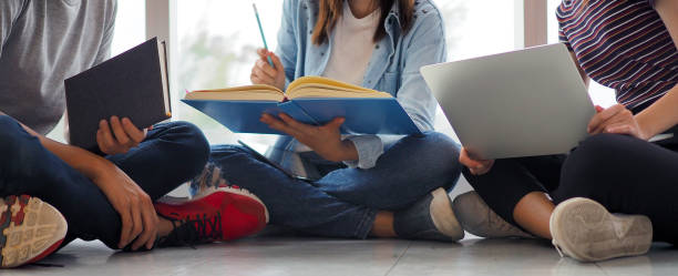 istock Student groups are viewing information in books and laptops. Willing to study together 1488085075