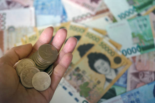 istock Korean won notes and Korean won coins for money concept background 1488087633