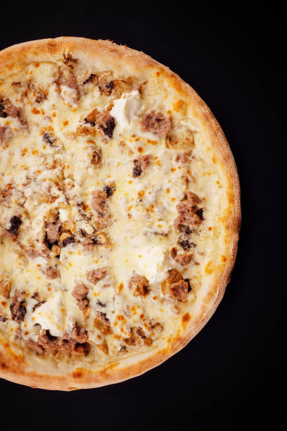 istock Tasty pizza with fresh ingredients on black 1488090243
