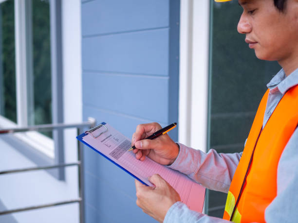 istock The inspector or engineer is checking the building structure and the requirements of the wall paint. After the renovation is completed 1488090420