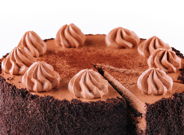 istock Chocolate Cake with Chocolate Fudge Drizzled Icing and Chocolate Curls isolated 1488090445