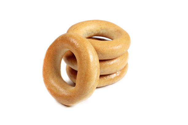 istock Stack of dry bagels isolated on white 1488091505