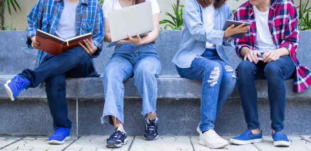 istock Student groups are viewing information in books and laptops. Willing to study together 1488097507