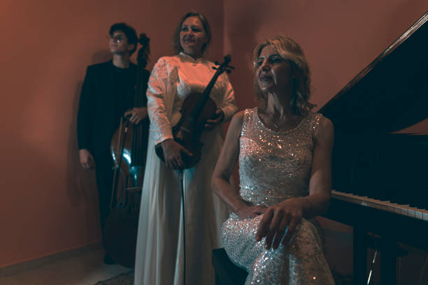 istock A band of three people pravos in a room. 1488097989