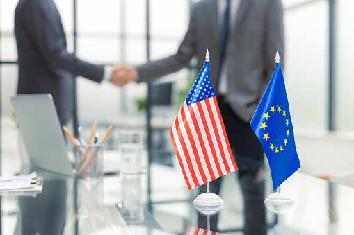 European Union and American leaders shaking hands on a deal agreement