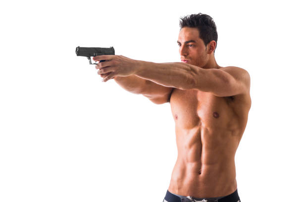 istock Athletic Topless Man Holding Handgun Against White 1488101183