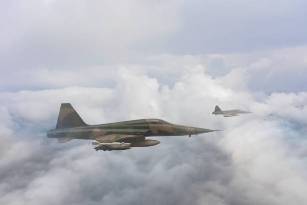 istock Jet aircrafts flying over the clouds. 1488101577