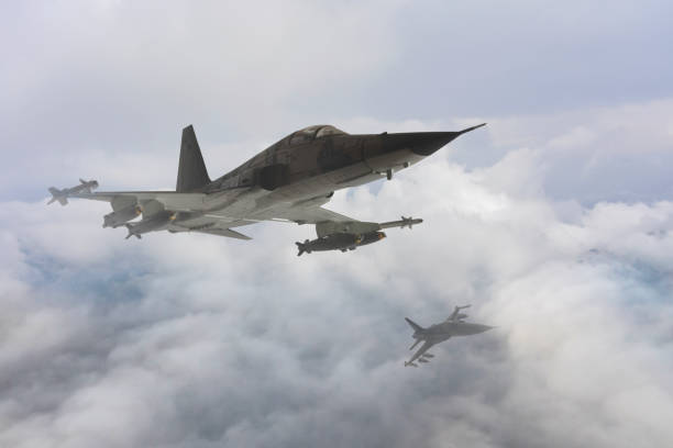istock Jet aircrafts flying over the clouds. 1488102581