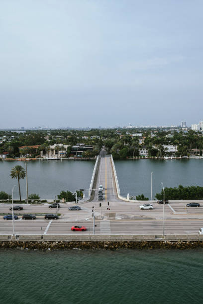 High angle view of traffic on MacArthur Causeway (A1A) in Miami, Florida, at the intersection with Fountain Street, which leads to Palm and Hibiscus Islands.  (April 29, 2023)