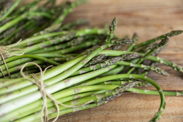 istock Bunch of raw asparagus spears, close up 1488105560