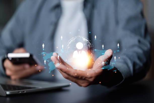istock Businessman showing virtual graphic human icon HR human resources recruitment team Staff management business concept. 1488106849