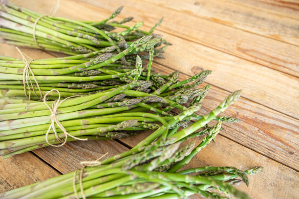 istock Bunch of raw asparagus spears, close up 1488107783
