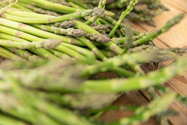 istock Bunch of raw asparagus spears, close up 1488108928